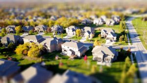 Keys to Understanding the Basics of Investing in Real Estate High angle shot of suburban real estate