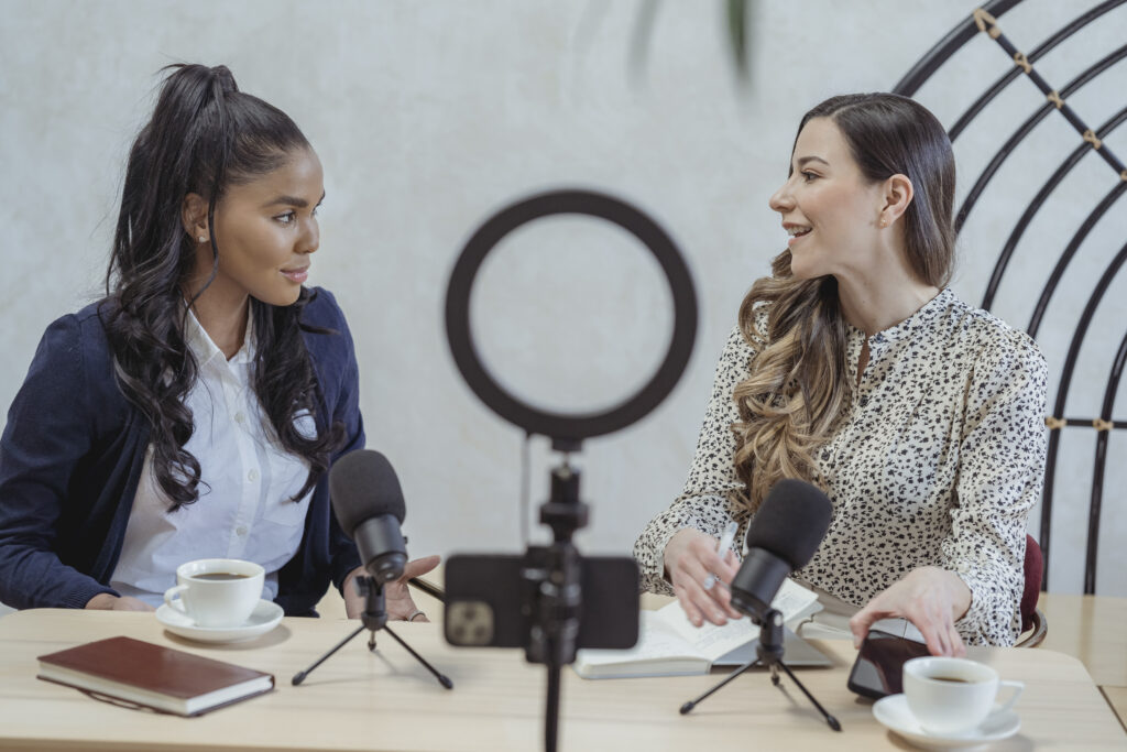 How to Become A Successful Social Media Influencer 1 influencer woman interviewing black female guest and recording video